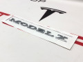 эмблема Tesla Model X 1 поколение (2015 - 2021), электро, 1047855-00-A, 1474572-00-A - фото №3