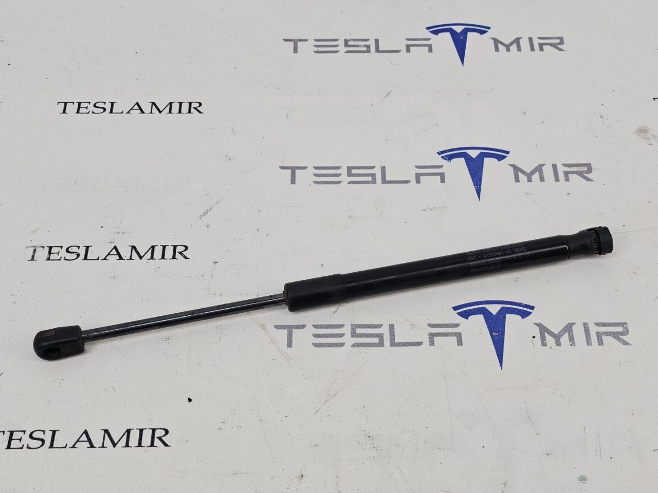 Амортизатор (упор) капота Tesla Model 3 1 поколение 2019, 1091870-00, 1089586-00, 1091472-00 - фото №1