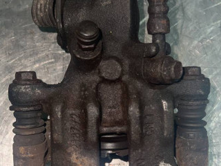 суппорт задний левый Nissan Almera N16 2000, 1.5 л., QG15DE, бензин, 5МКПП, хетчбэк 5 дв.