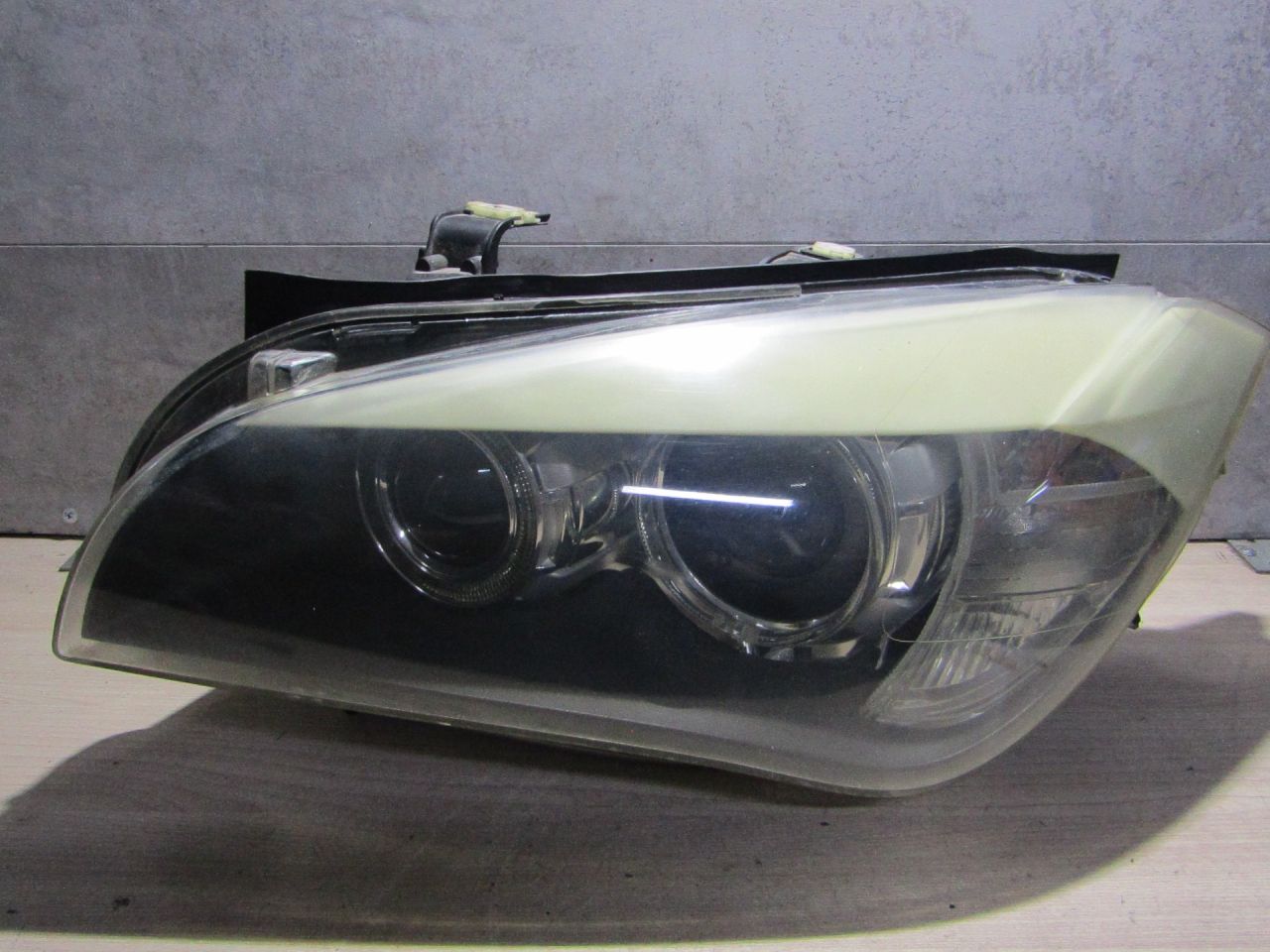 фара левая BMW X1 E84 (2009 - 2012) - фото №1
