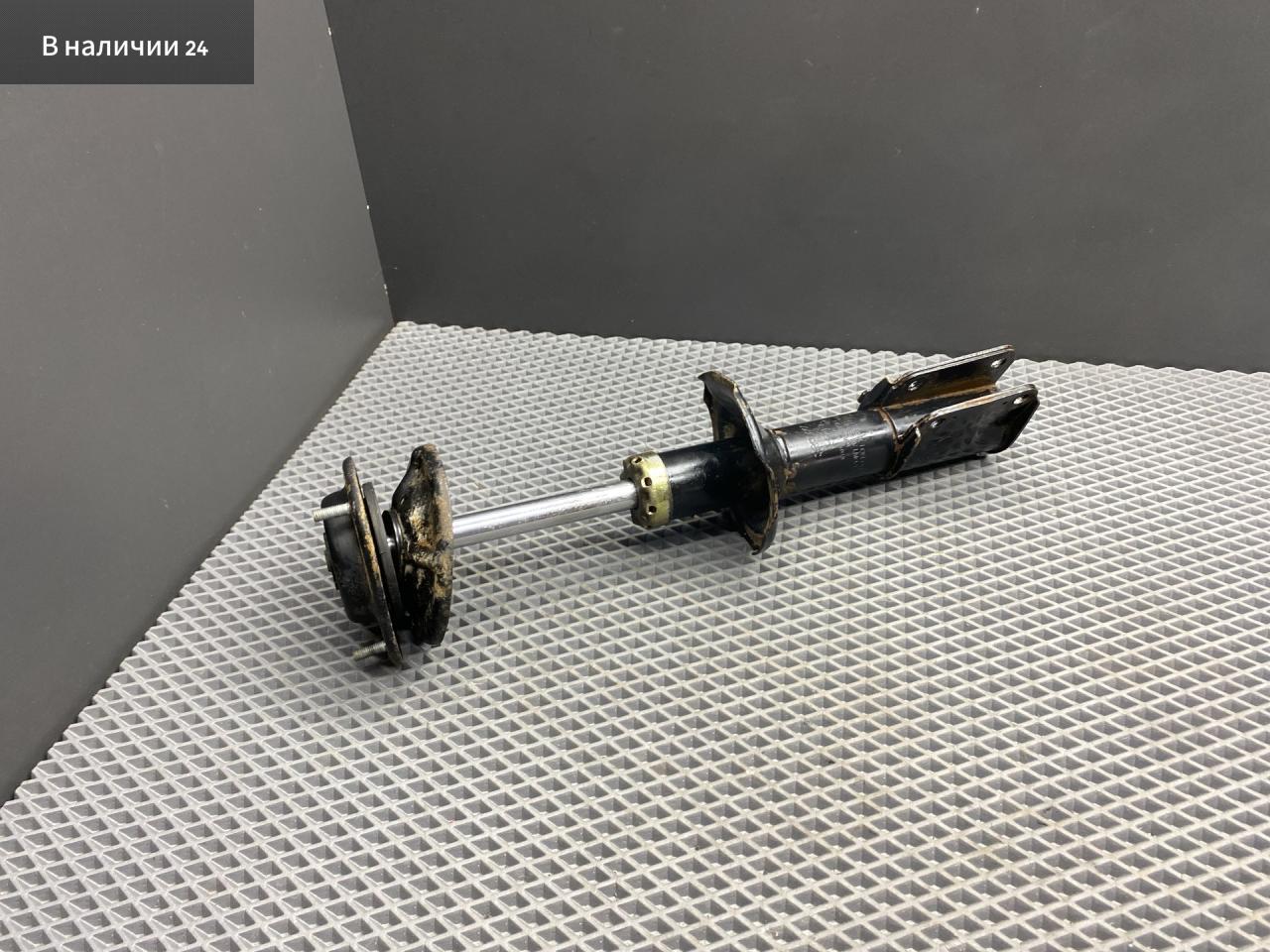 стойка передняя левая Toyota Cami 1 поколение J122E 2001, 1.3 л., K3-VE, бензин, АКПП, 6a5 - черный, внедорожник 5 дв., задний привод, правый руль, 48520-87416 - фото №1