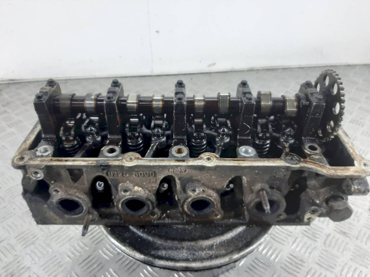 головка блока цилиндров Ford Fiesta 5 поколение 2005, 1.3 л., i, 1N2G6090 - фото №1