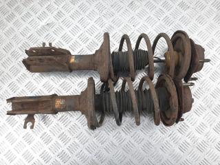 стойка передняя левая Mazda 323 6 поколение 1999