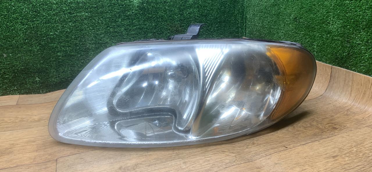 фара левая Dodge Caravan 4 поколение 2002, 2.4 л., бензин, АКПП, минивэн - фото №1