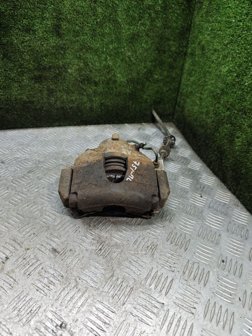 суппорт передний левый Renault Laguna 2 поколение 2002, 1.9 л., DCi, дизель, 6МКПП, хетчбэк 5 дв. - фото №1