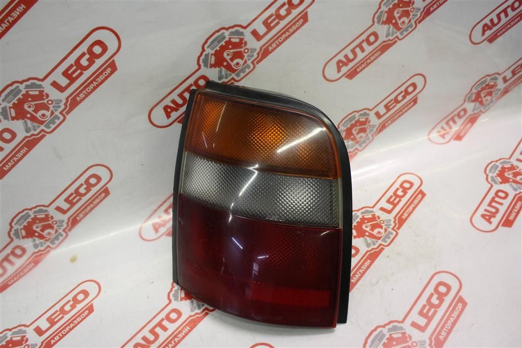 фонарь задний левый Nissan March K11 AK11 1994, 1.3 л., CG13DE, бензин, АКПП, черный, купе, передний привод, правый руль - фото №1