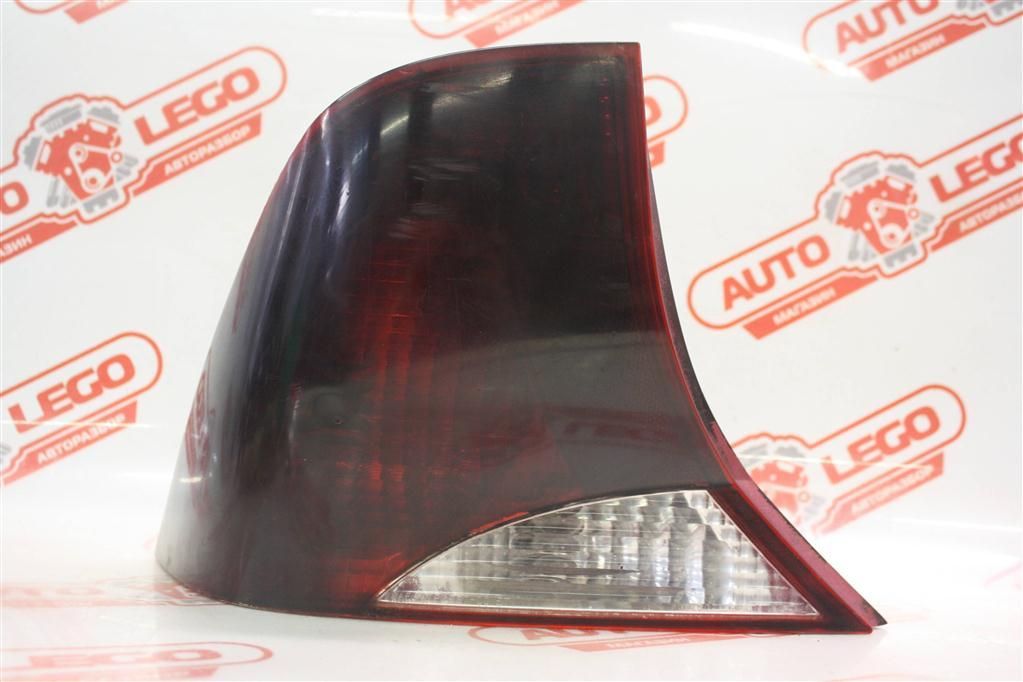 фонарь задний левый Ford Focus 1 поколение BK 2000, 2.0 л., Zetec , бензин, АКПП, серый, седан, передний привод - фото №1