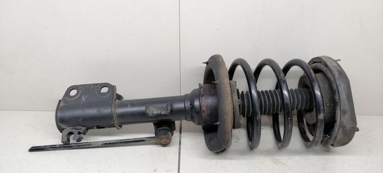 стойка передняя левая Renault Laguna 1 поколение 1997, 2.2 л., DT, G8T 792, дизель, 5МКПП, бирюзовый, универсал, передний привод - фото №1