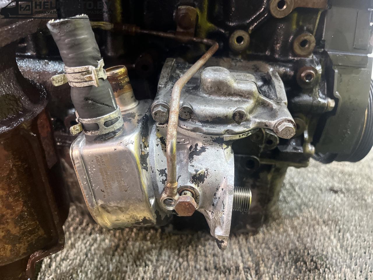 теплообменник масляного фильтра Ford Focus 1 поколение (1998 - 2001), дизель, МКПП, белый, универсал, передний привод, 93FF6B856AA, 93FF-6A642-AA - фото №1