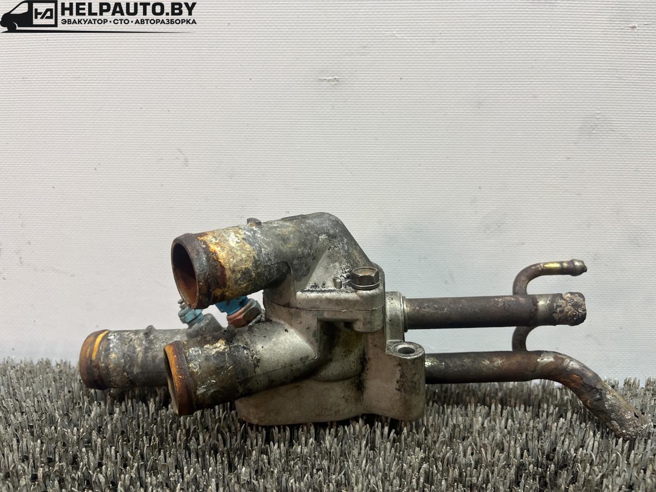 корпус термостата Hyundai Coupe RD 1998, 2.0 л., бензин, МКПП, бордовый, купе, передний привод - фото №1