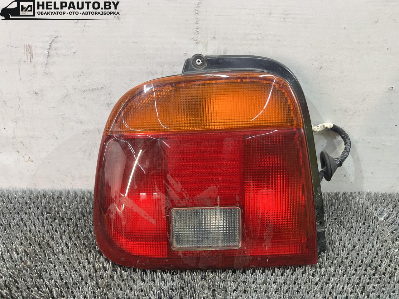 фонарь задний левый Suzuki Baleno 1 поколение 2002, 1.5 л., бензин, МКПП, чёрный, седан, 220-32021, 12V215W - фото №1