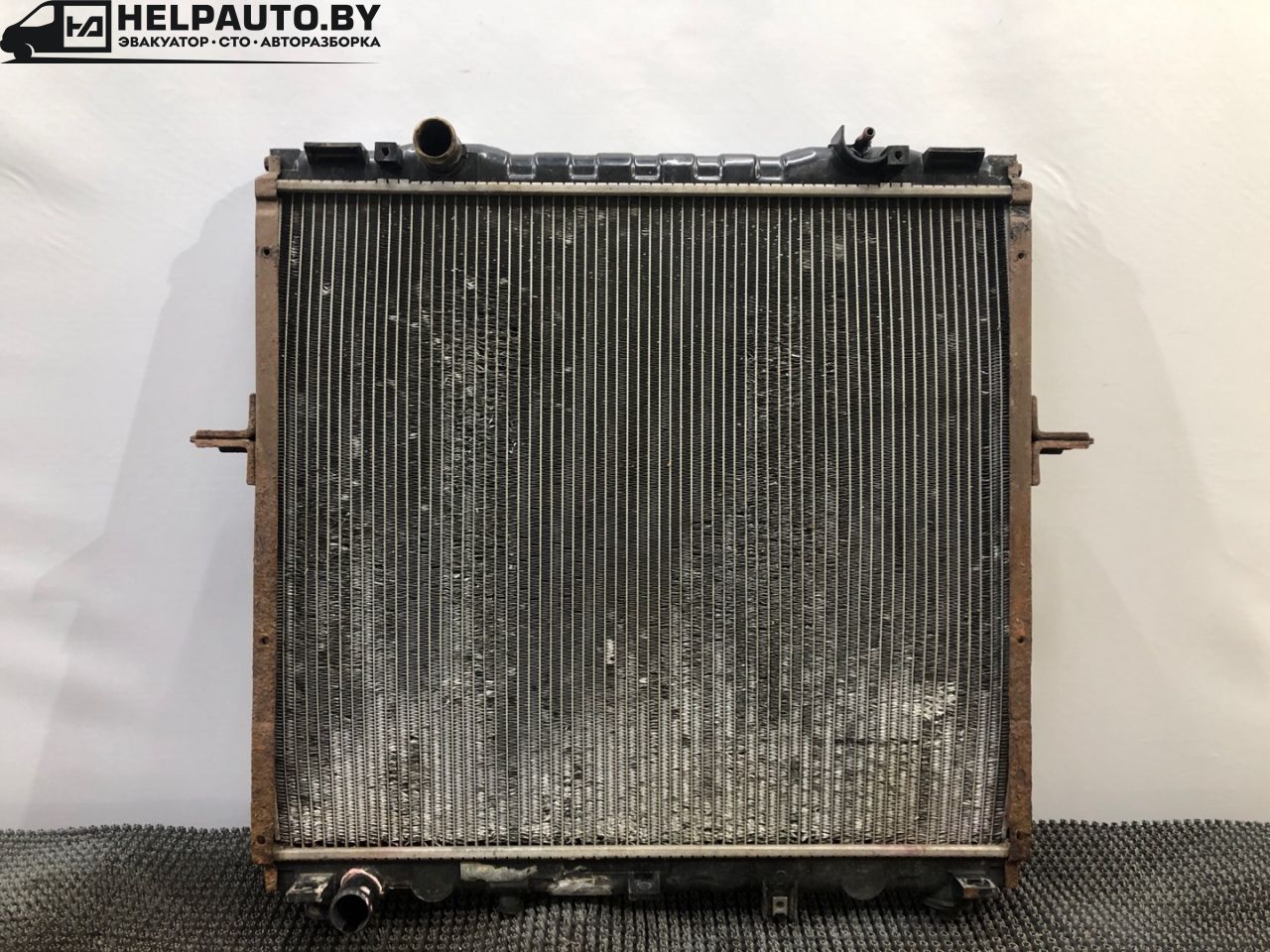 радиатор (основной) Kia Sorento 1 поколение 2005, 2.4 л., G4JS, бензин, МКПП, красный, внедорожник 5 дв., полный подключаемый привод - фото №1