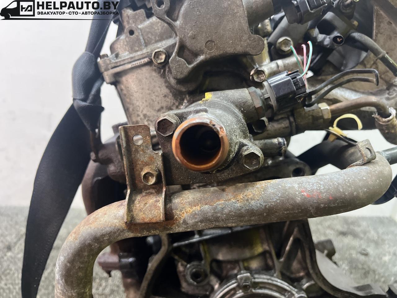 корпус термостата Suzuki Baleno 1 поколение 2002, 1.5 л., бензин, МКПП, чёрный, седан - фото №1