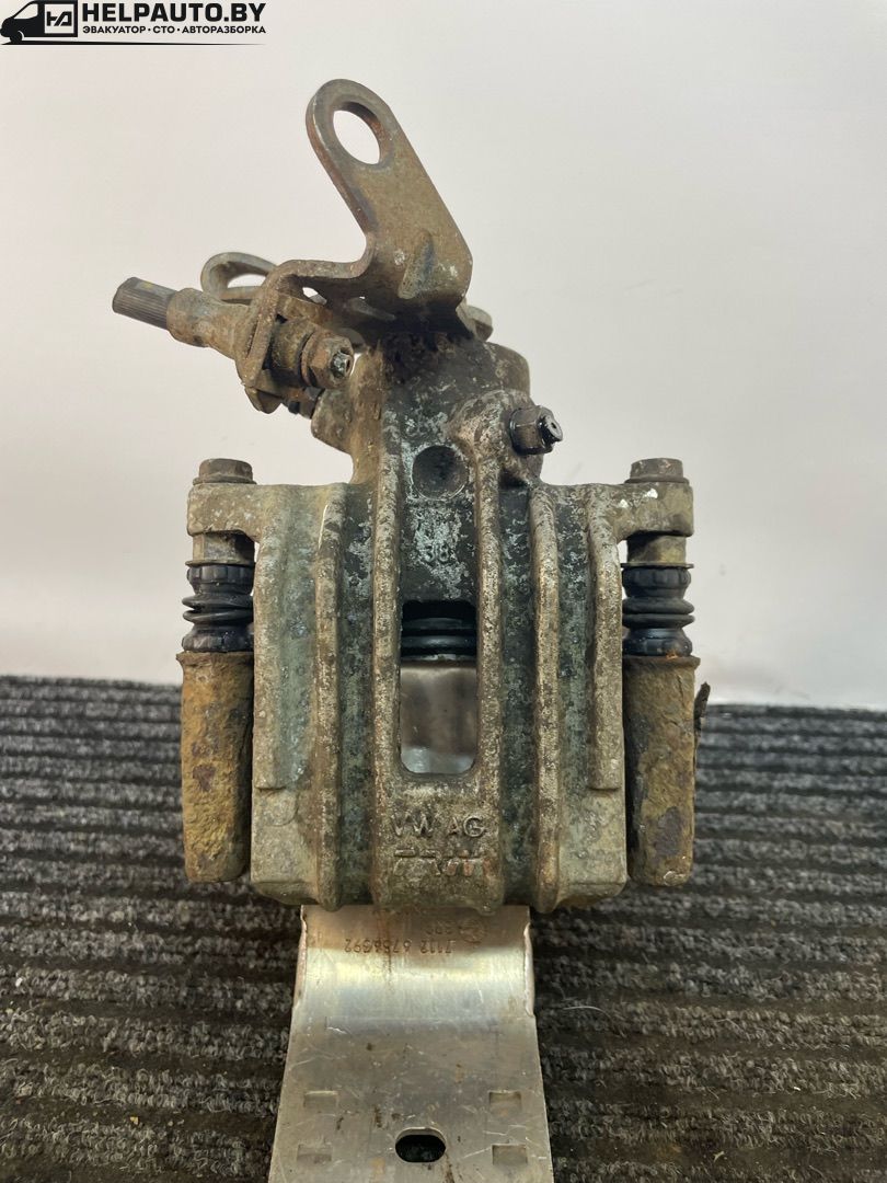 суппорт задний левый Volkswagen Golf 5 поколение 2008, 1.4 л., BUD, бензин, 5МКПП, синий, хетчбэк 5 дв., передний привод - фото №1