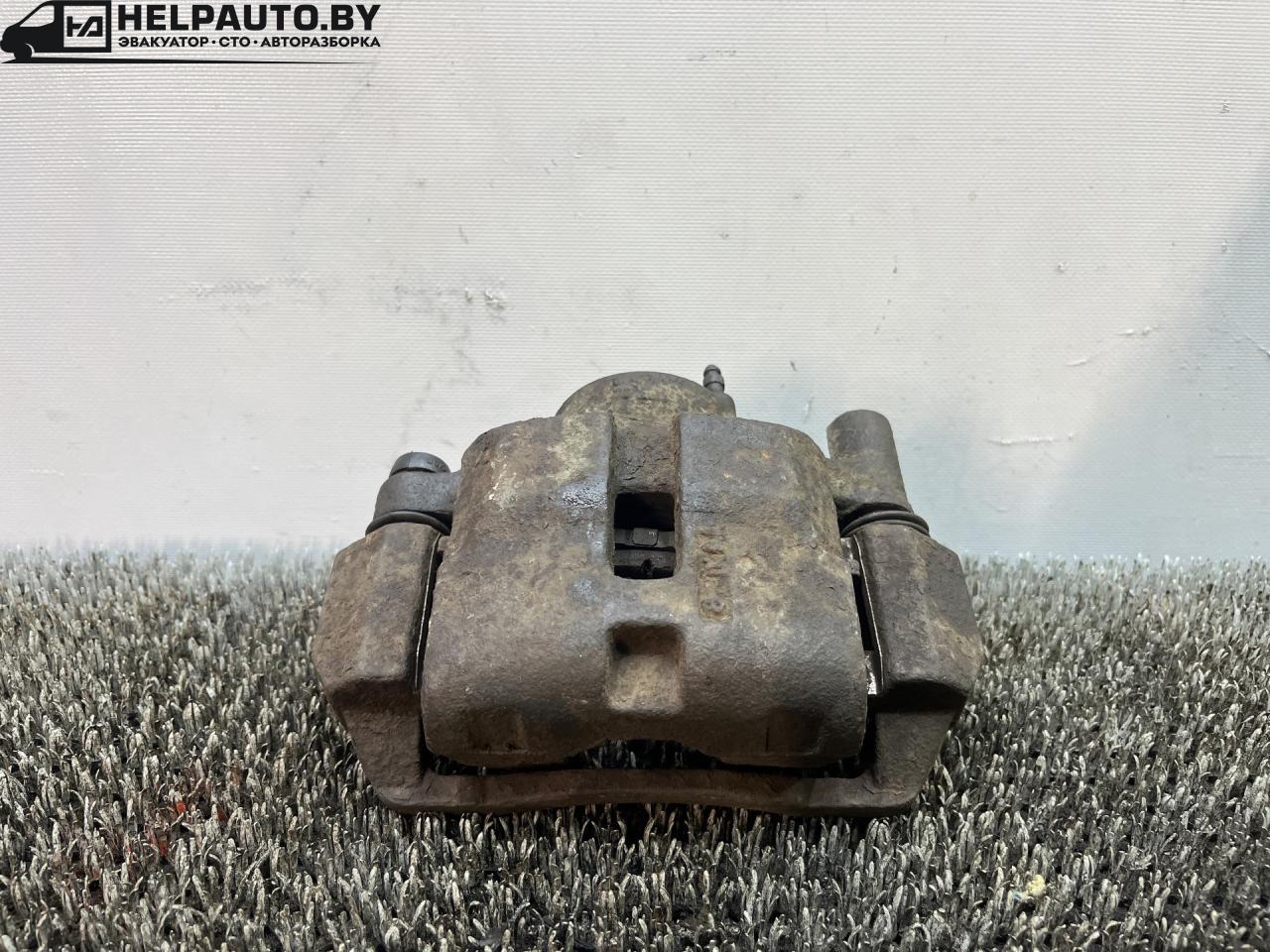 суппорт передний левый Mazda 626 GF (1997 - 1999), 2.0 л., дизель, МКПП, передний привод - фото №1