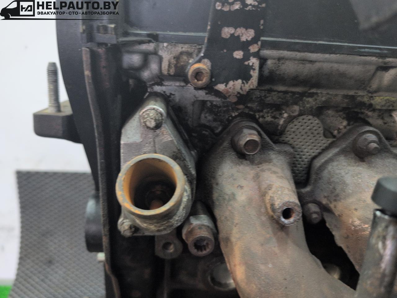 корпус термостата Daewoo Evanda 1 поколение V200 2003, 2.0 л., i, X 20 SED, бензин, МКПП, берюзовый, седан, передний привод - фото №1