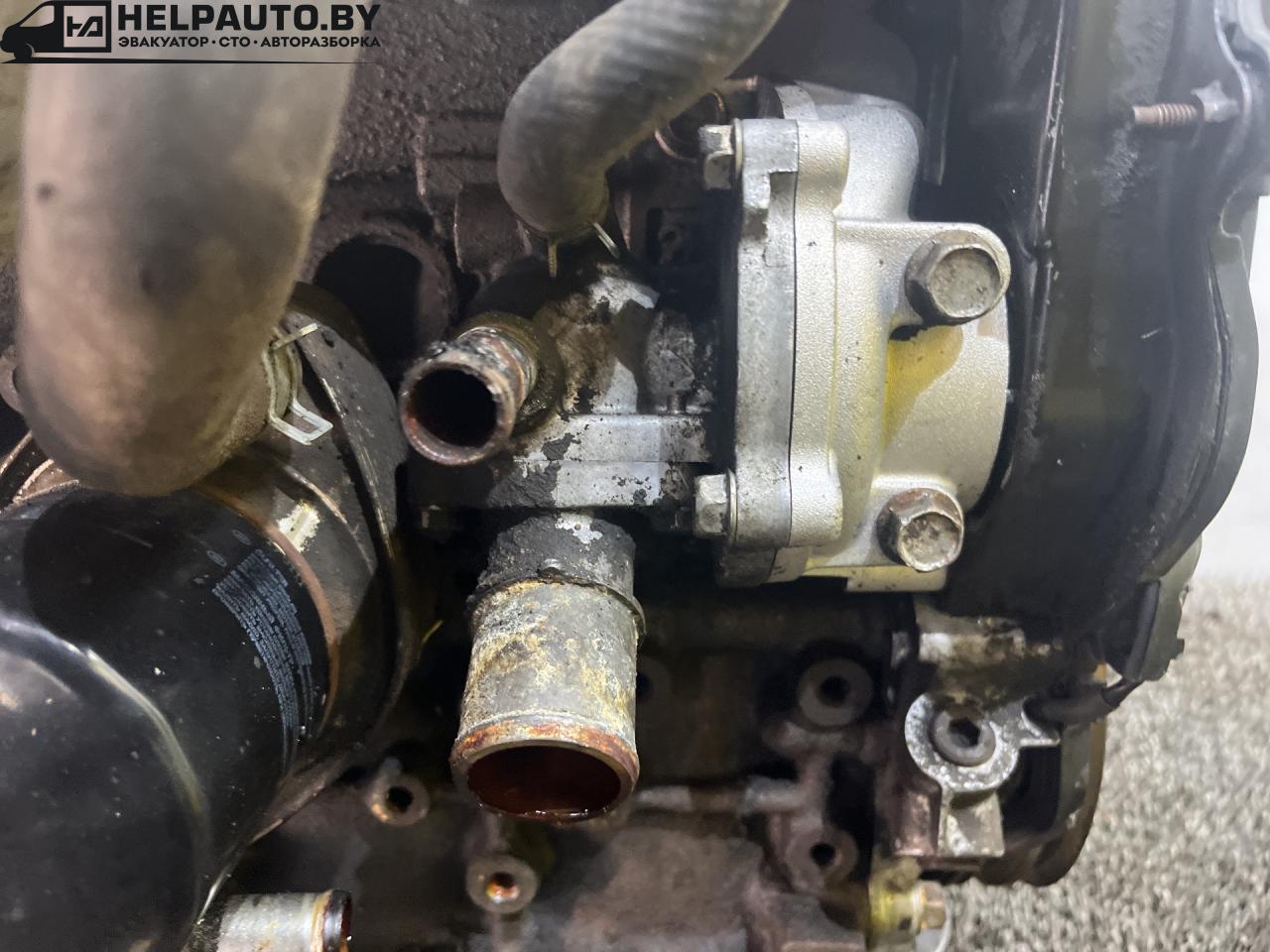 корпус термостата Mazda 626 GF 1998, 2.0 л., дизель, МКПП, передний привод - фото №1