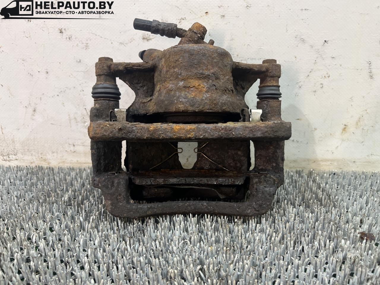 суппорт передний левый Toyota Carina E 1 поколение T190 1995, 1.6 л., 4A-FE, бензин, МКПП, зелёный, хетчбэк 5 дв., передний привод - фото №1