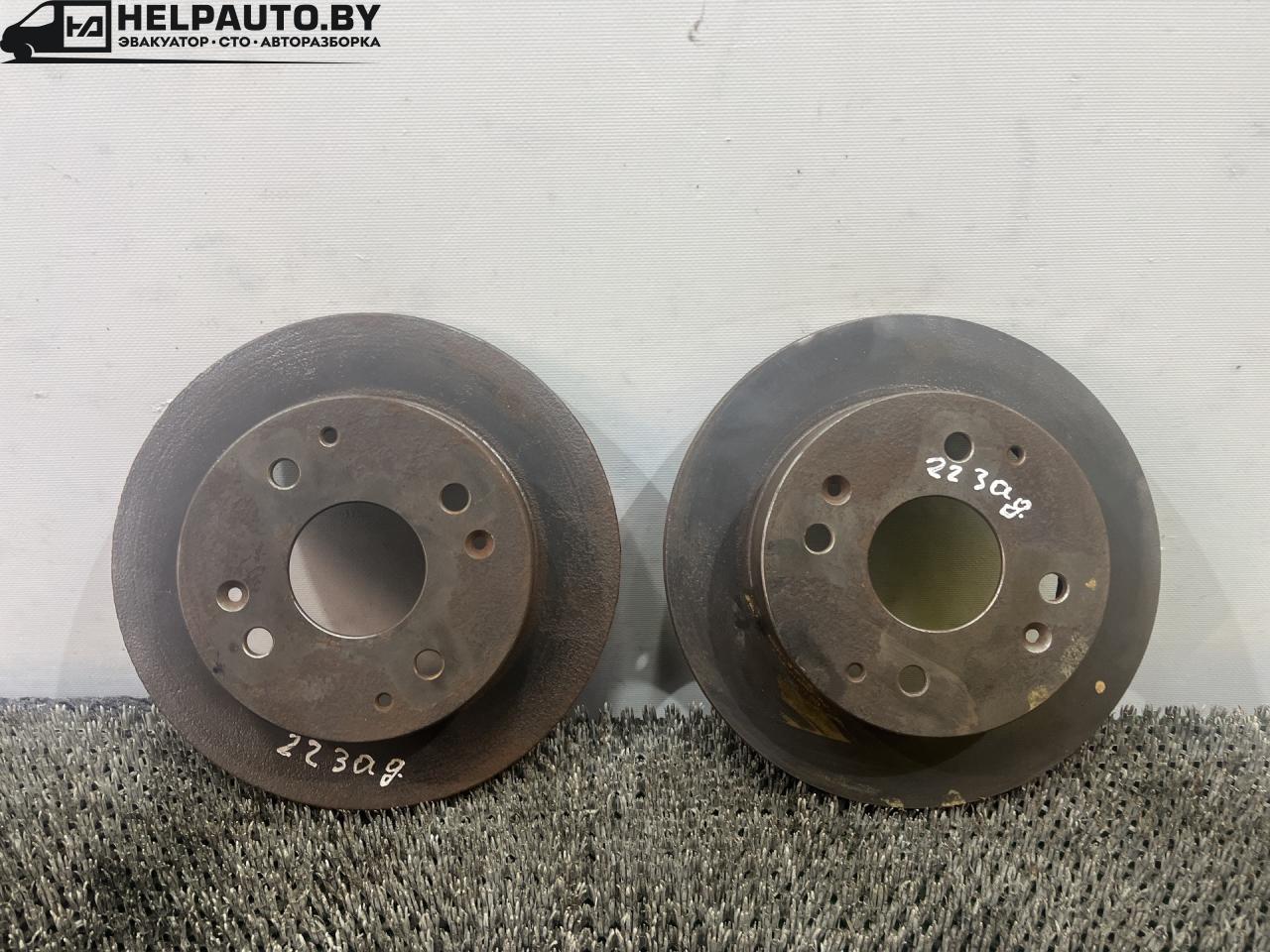 диски тормозные задние Rover 600 Series 1 поколение 1994, 2.0 л., бензин, МКПП, зелёный, седан, передний привод - фото №1