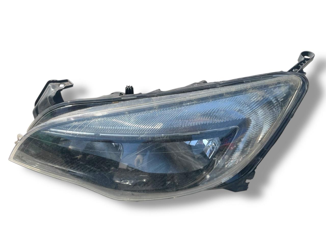 фара левая Opel Astra J 2010, 1.4 л., A 14 NET, бензин, 6МКПП, karbongrau / gal, хетчбэк 5 дв., передний привод, правый руль, 13297720 - фото №1