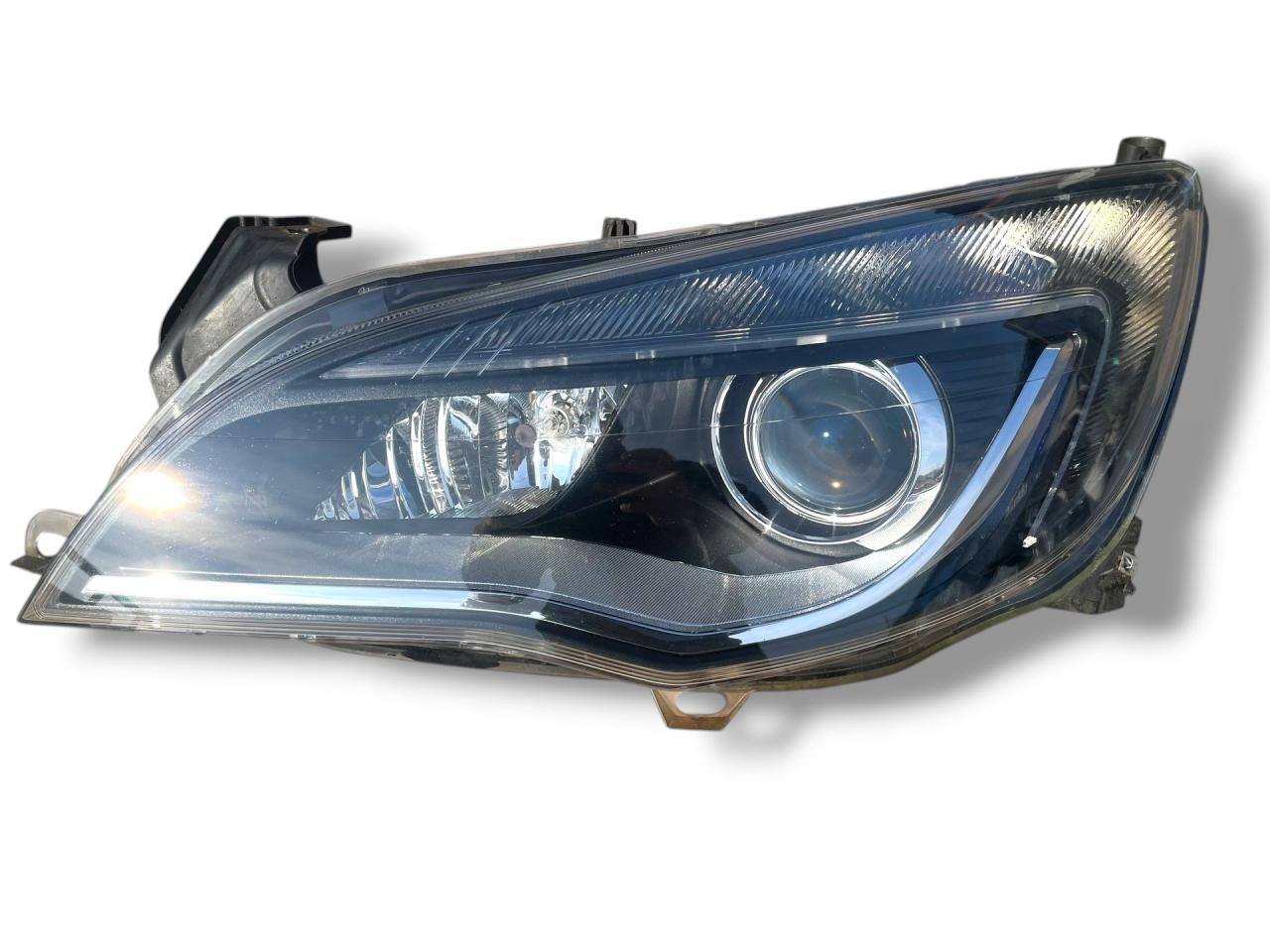 фара левая Opel Astra J 2011, 1.7 л., A 17 DTR, дизель, 6МКПП, saphirschwarz / 20r, хетчбэк 5 дв., передний привод, правый руль, 13253650, 1ZT01001201 - фото №1