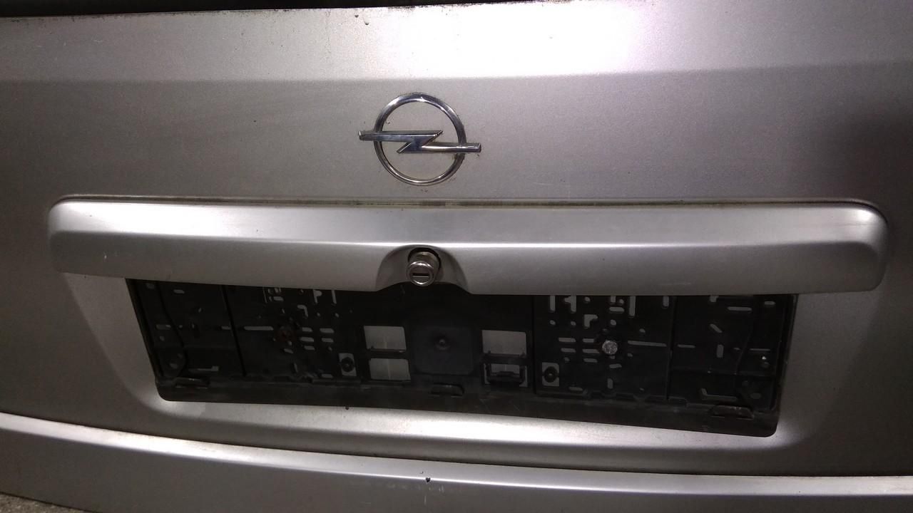 накладка подсветки номера Opel Astra G 2001 - фото №1