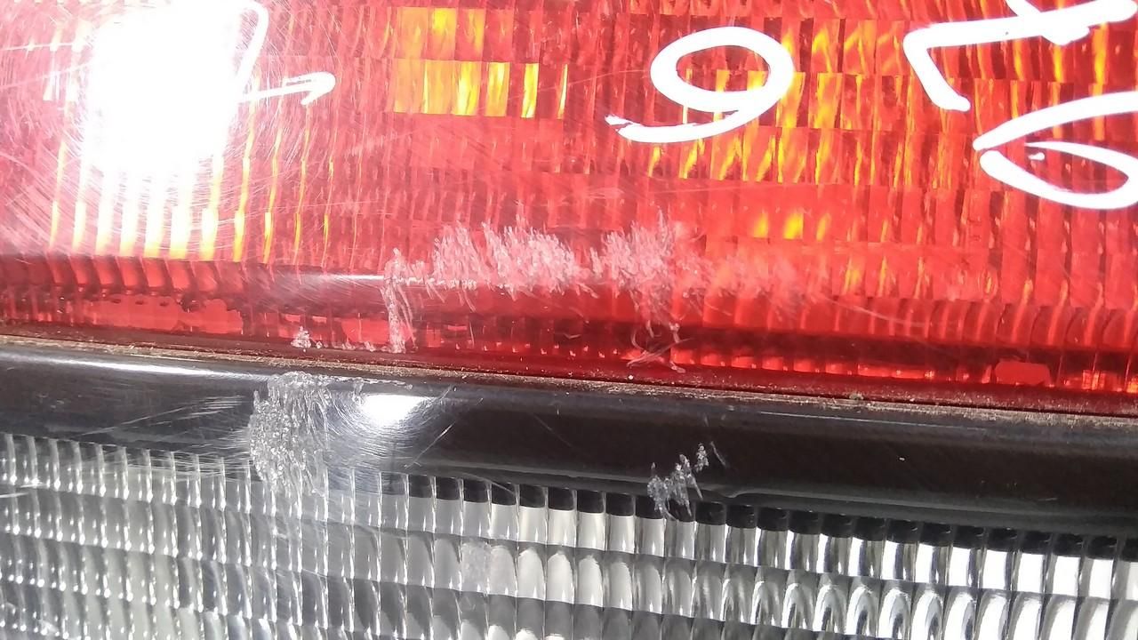 фонарь крышки багажника левый Mazda 626 GF (1997 - 1999), хетчбэк 5 дв. - фото №1