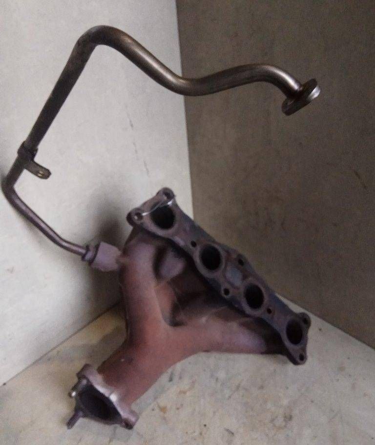 коллектор выпускной Mazda 323F BA 1996, 1.5 л., i, Z5-DE, бензин, МКПП, зеленый, хетчбэк 5 дв., передний привод, B67K13450A - фото №1