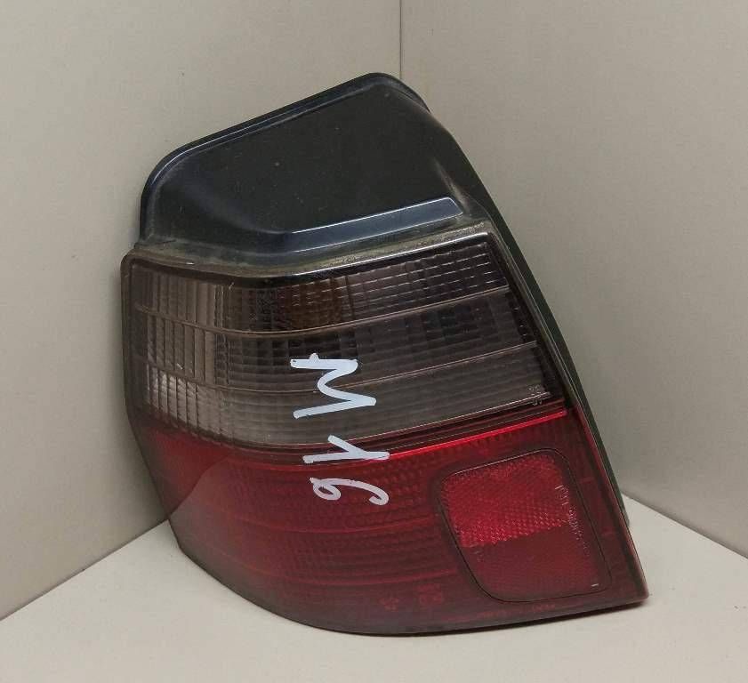 фонарь задний левый Mitsubishi Galant 8 поколение EA2W 1998, 2.0 л., i, 4G63 (SOHC 16V), бензин, АКПП, темно-серый, универсал, передний привод, MR325365 - фото №1