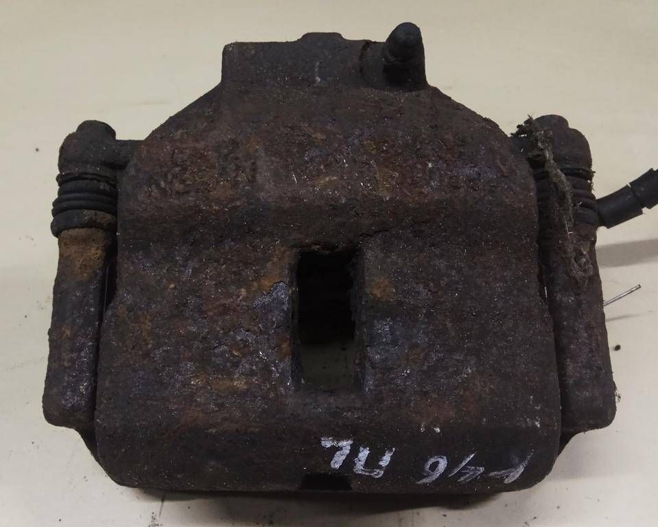 суппорт передний левый Nissan Primera P11 1996, 2.0 л., DT, CD20T, дизель, 5МКПП, красный, седан, передний привод, 410112F021 - фото №1