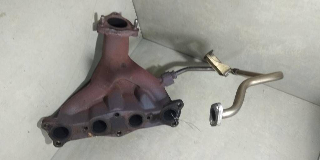 коллектор выпускной Mazda 323F BA 1997, 1.5 л., i, Z5-DE, бензин, МКПП, серебристый, хетчбэк 5 дв., передний привод, B67K13450A - фото №1