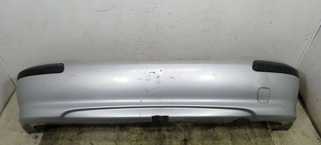 бампер задний Nissan Almera N16 2000, 2.2 л., DTi, YD22DDT, дизель, 5МКПП, серебристый, хетчбэк 5 дв., передний привод, 850224M540 - фото №1