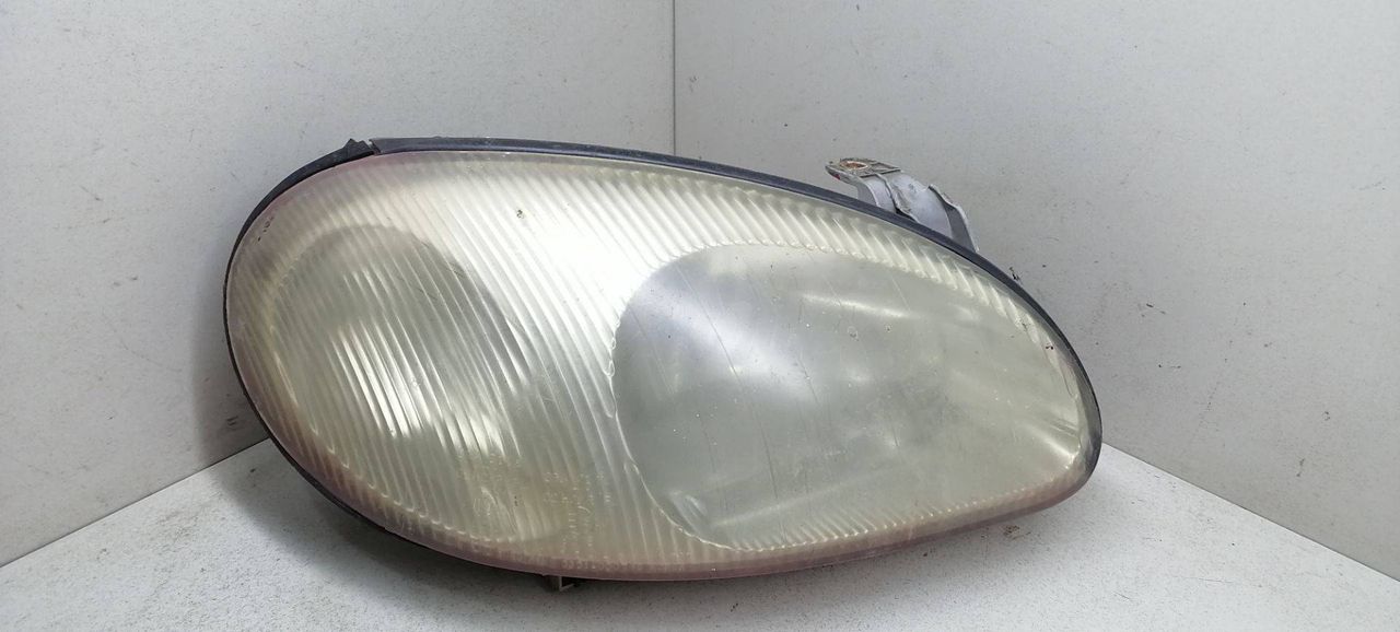 фара правая Daewoo Lanos T100 1999, 1.5 л., i, бензин, 5МКПП, бордовый, хетчбэк 5 дв., передний привод, 0301000784 - фото №1