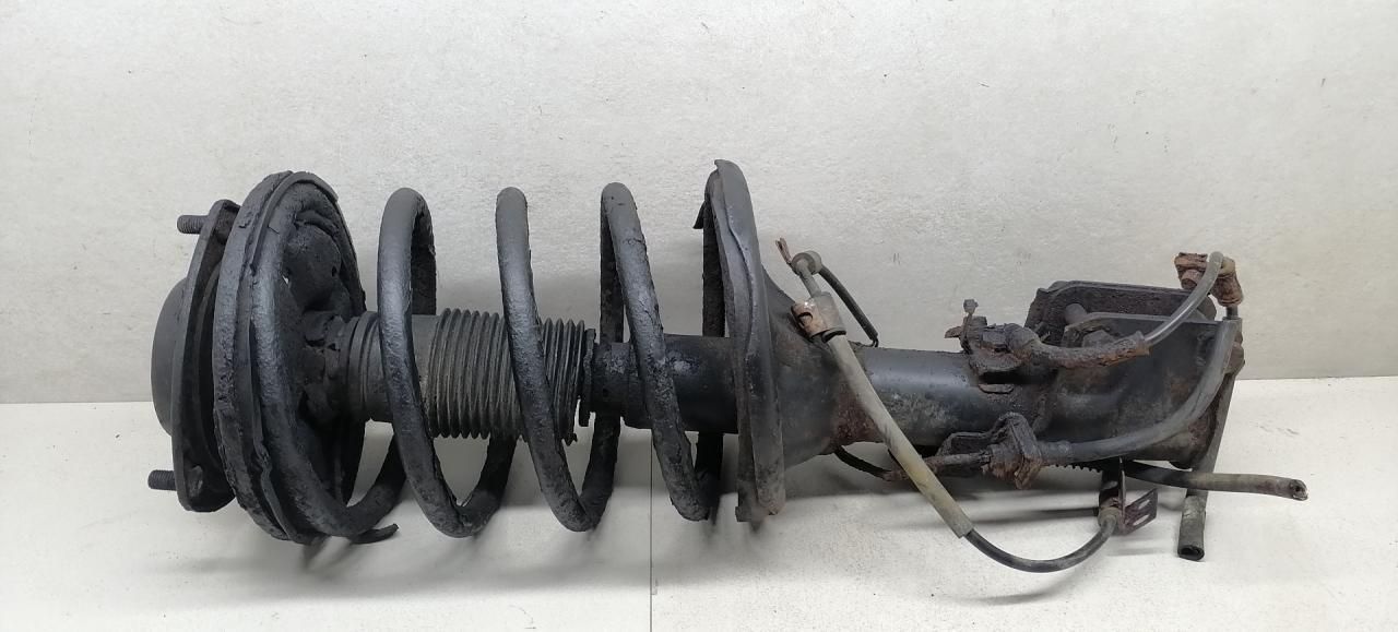 амортизатор передний правый Mitsubishi Sigma 1 поколение 1994, 3.0 л., i, 6G72 (DOHC 24V), бензин, 5МКПП, серый металлик, седан, передний привод