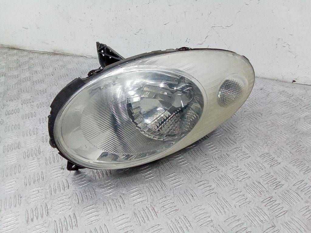 фара левая Nissan Micra 3 поколение (K12) 2005, 260605665R
