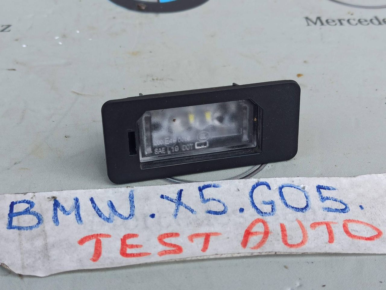 подсветка номера BMW X5 G05 [рестайлинг] 2023, 4.4 л., S68B44A, бензин, c4p, 9481841