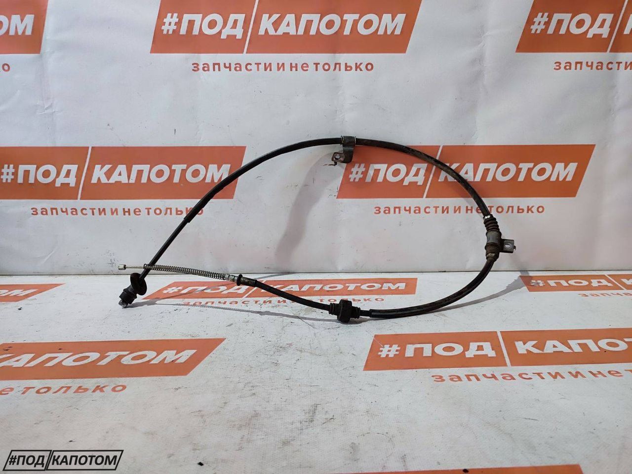трос ручника Mitsubishi Lancer 10 поколение 2009, 2.0 л., 4B11, бензин, АКПП, a86b, седан, передний привод - фото №1