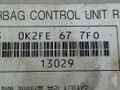 блок AirBag Kia Carens 2 поколение FJ 2006, 2.0 л., CRDi, дизель, 5МКПП, чёрный, минивэн, передний привод, OK2FE677F0 - фото №3