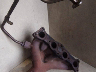 коллектор выпускной Mazda 323F BA 1996, 1.5 л., i, Z5-DE, бензин, МКПП, зеленый, хетчбэк 5 дв., передний привод, B67K13450A
