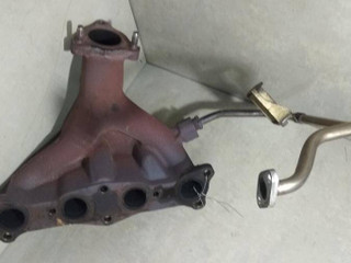 коллектор выпускной Mazda 323F BA 1997, 1.5 л., i, Z5-DE, бензин, МКПП, серебристый, хетчбэк 5 дв., передний привод, B67K13450A