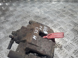суппорт передний правый Mazda 323 6 поколение 1999, 2.0 л., RF3F, дизель, 5МКПП, красный, хетчбэк 5 дв.