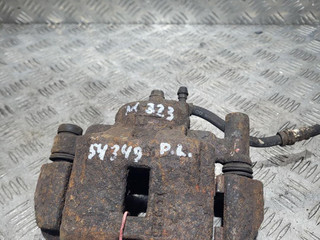 суппорт передний левый Mazda 323 6 поколение 1999, 2.0 л., RF3F, дизель, 5МКПП, красный, хетчбэк 5 дв.