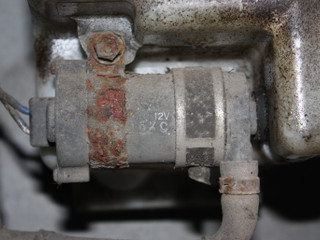 насос (моторчик) омывателя фар Mitsubishi Outlander 1 поколение 2004, 2.0 л., бензин