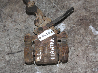 суппорт задний левый Hyundai Elantra XD (2000 - 2003)