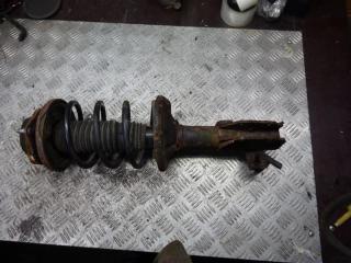 стойка передняя левая Mazda 323 6 поколение 1999, 1.3 л., бензин, МКПП, хетчбэк 5 дв.