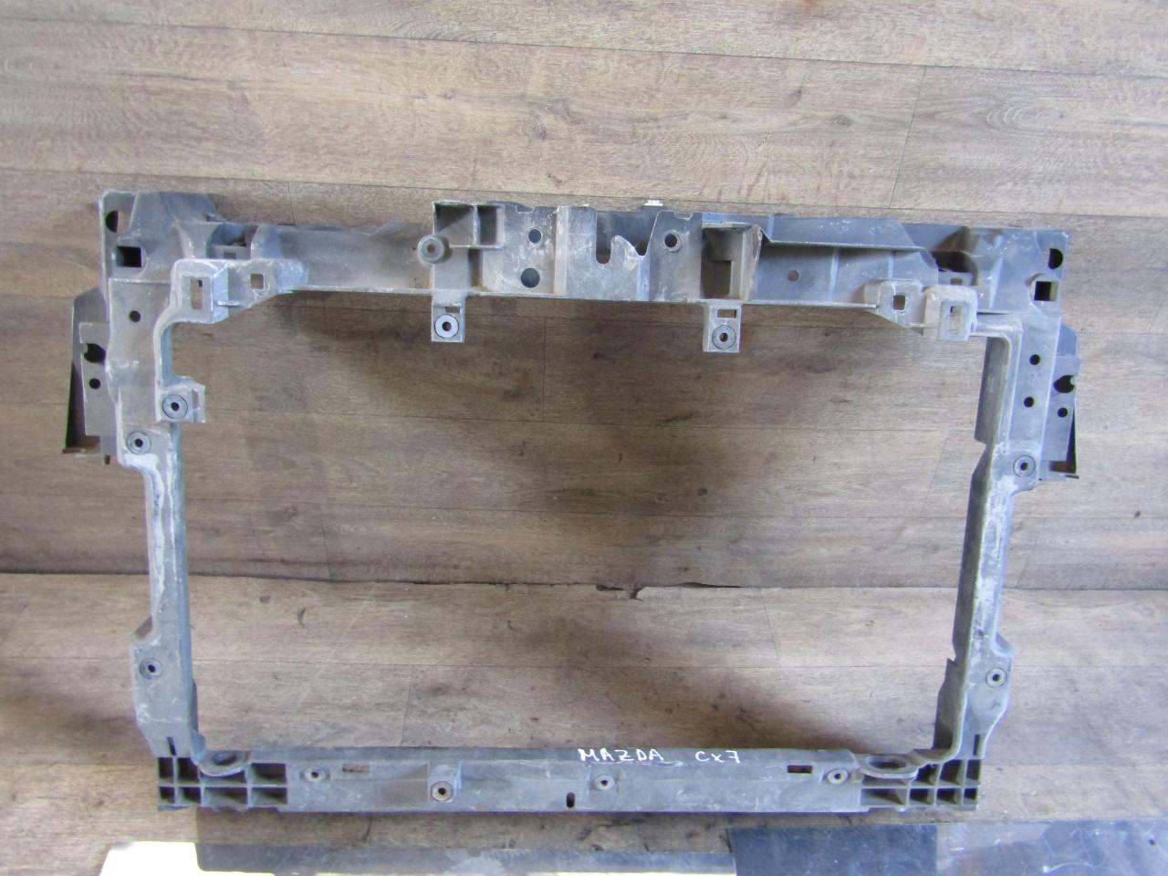 передняя панель крепления облицовки (телевизор) Mazda CX-7 1 поколение (2006 - 2009), L20653110D, L20653110E, L20653110F, L20653110G, L20653110, EH1053110B, EH1053110A, EH4453110 - фото №1