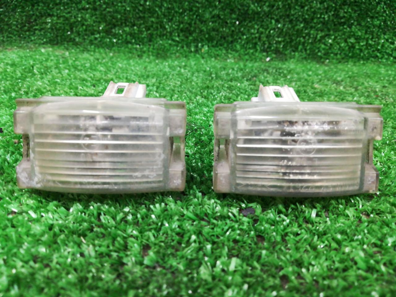 подсветка номера Mazda 2 1 поколение 2005, 1.2 л., бензин, передний привод, правый руль - фото №1