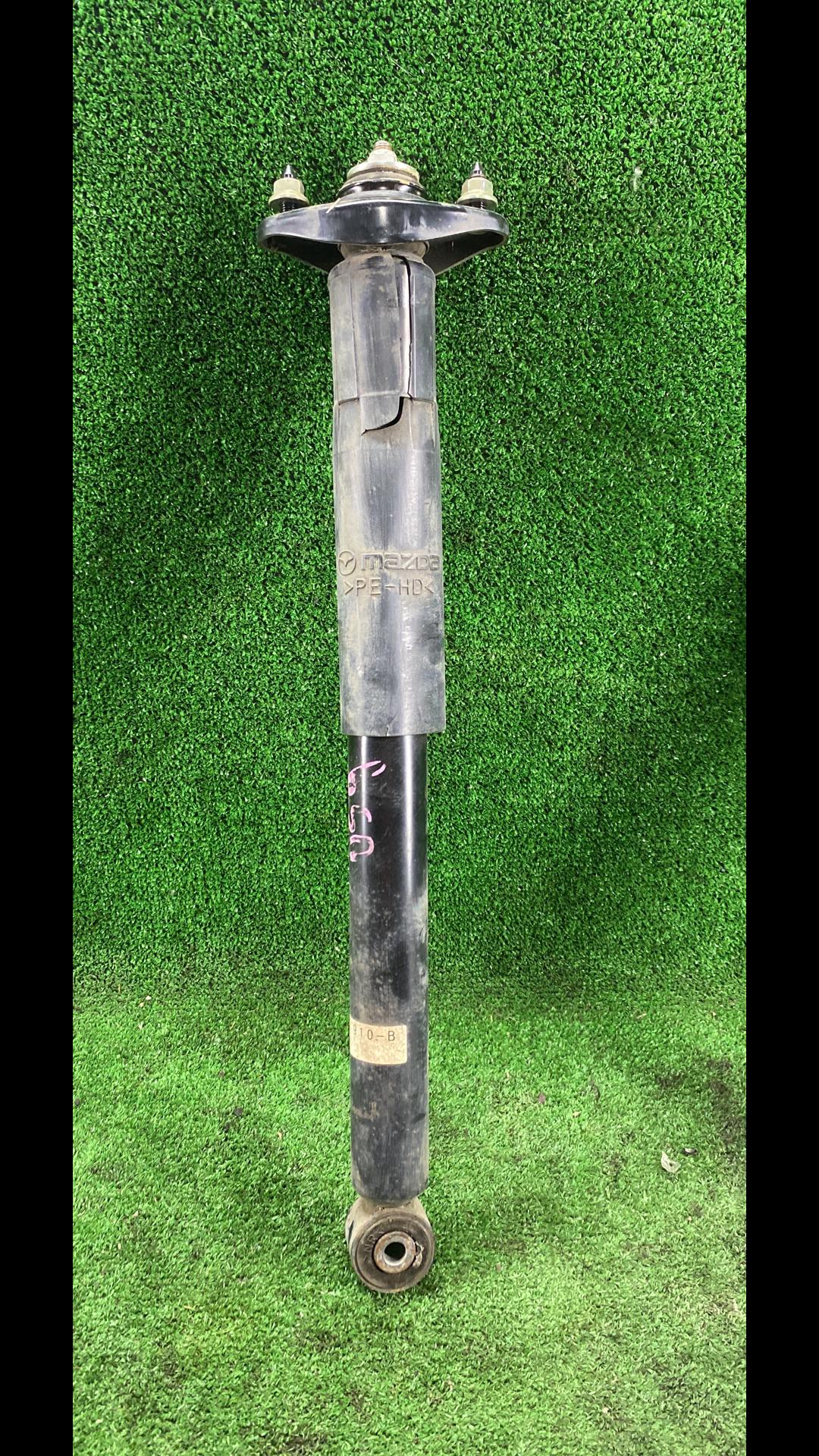 амортизатор задний левый Mazda CX-7 1 поколение 2007, 2.3 л., бензин, АКПП, передний привод - фото №1