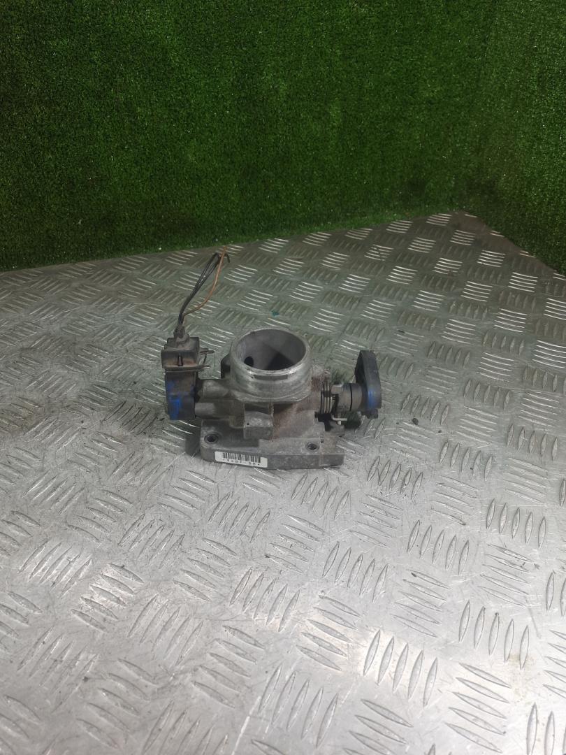 заслонка дроссельная Ford Fiesta 4 поколение 1997, 1.3 л., бензин, МКПП, хетчбэк 5 дв. - фото №1