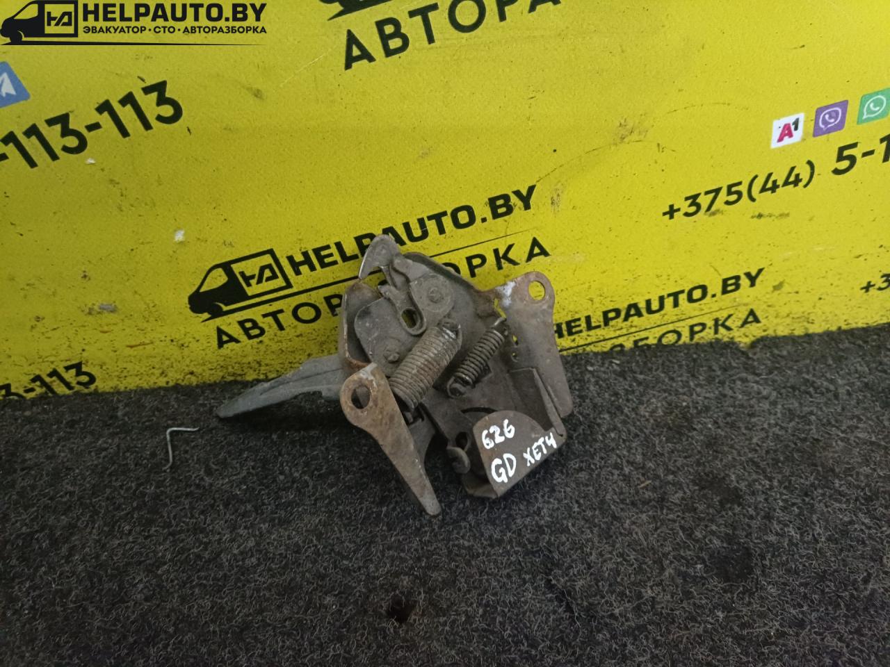замок капота Mazda 626 3 поколение 1990, 2.0 л., бензин, МКПП, хетчбэк 5 дв., передний привод - фото №1